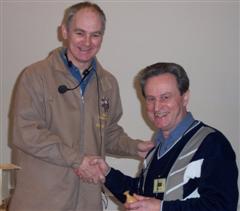 Geoff Hunt receives last month's Certificate for the winning piece from David Springett